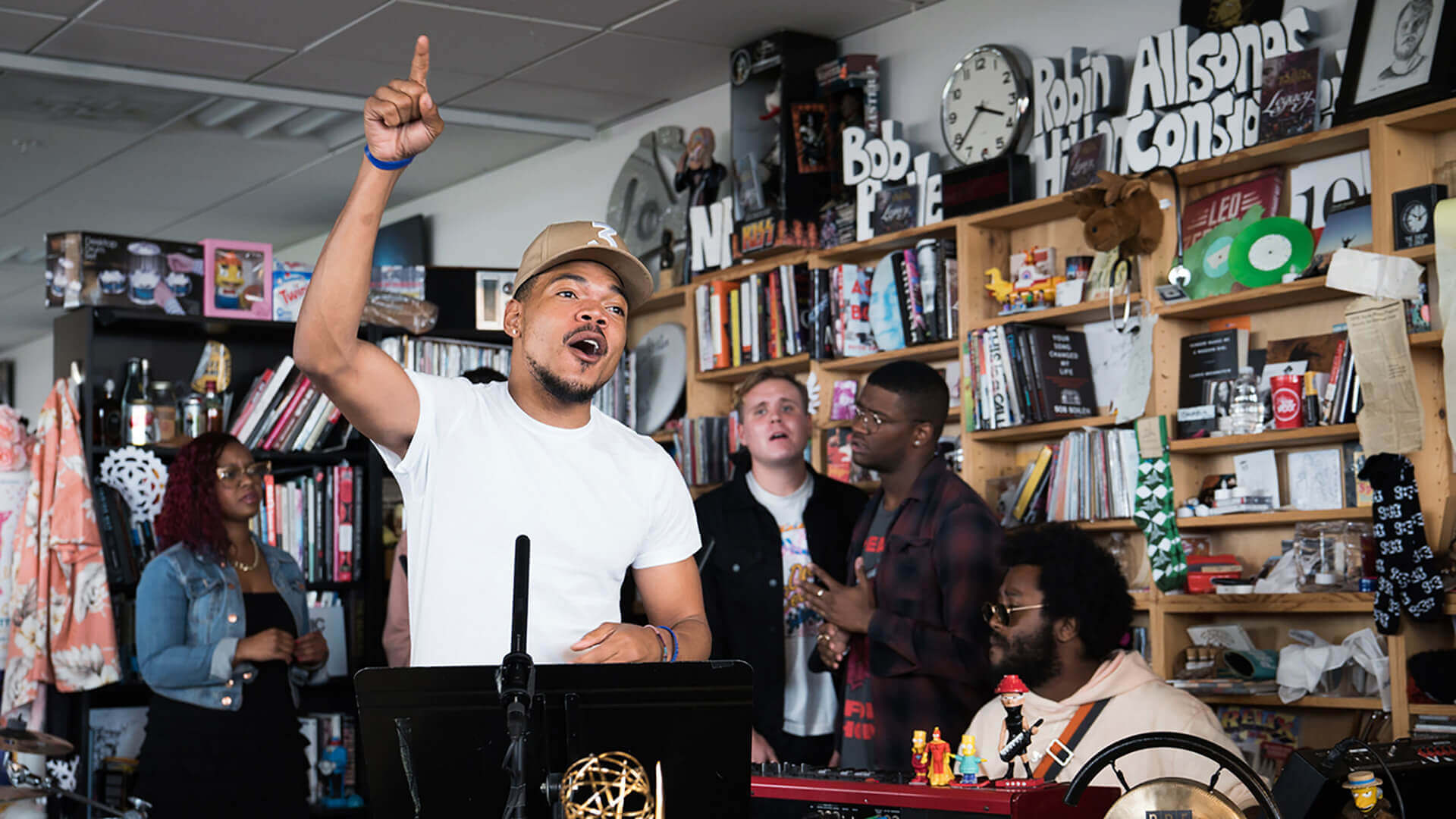 A band playing at the Tiny Desk concert room.